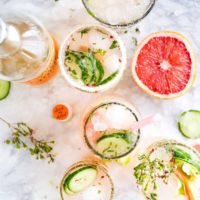 flatlay photography of sliced fruits and cucumbers